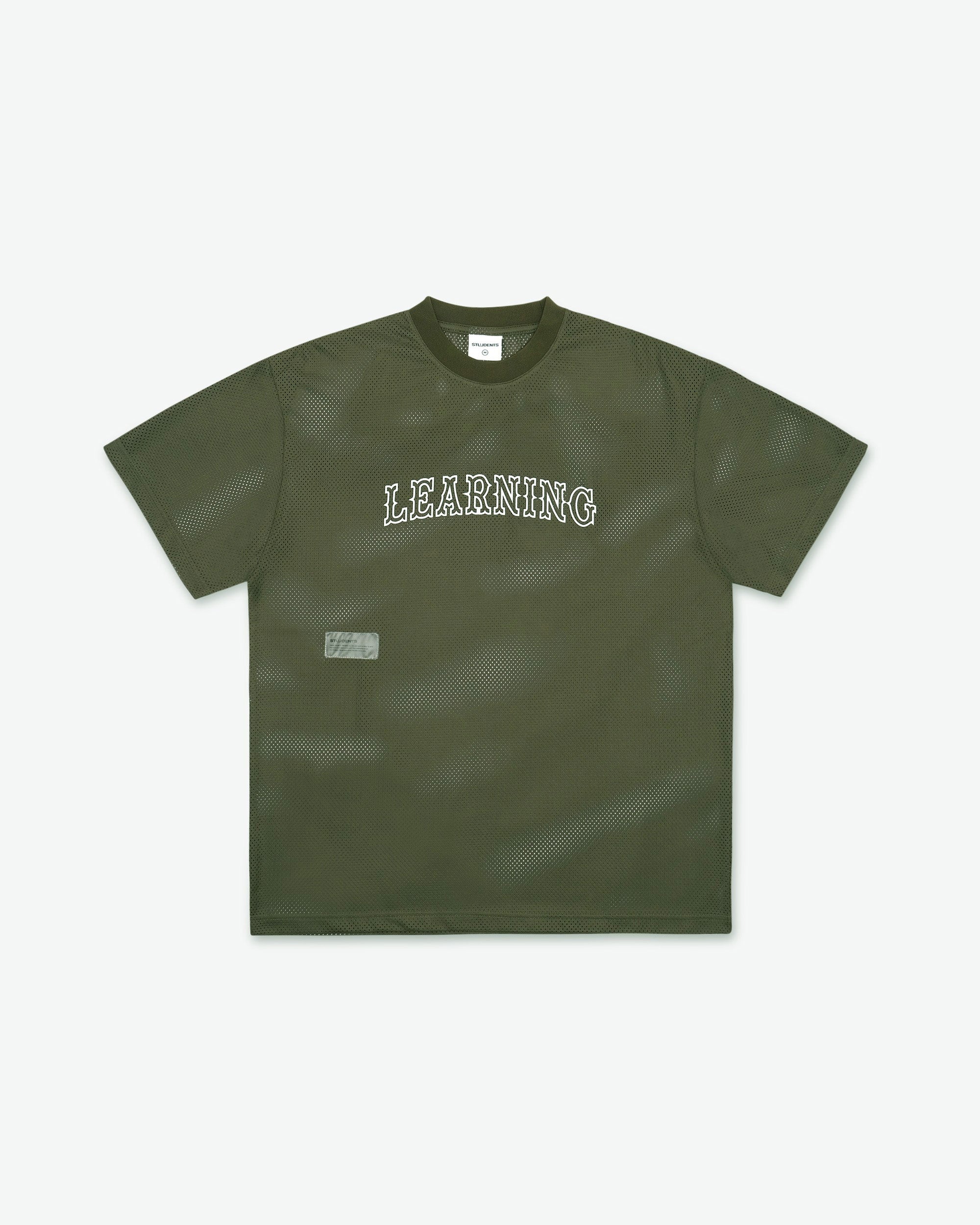 Green t-shirt with 'LEARNING' text on a white background