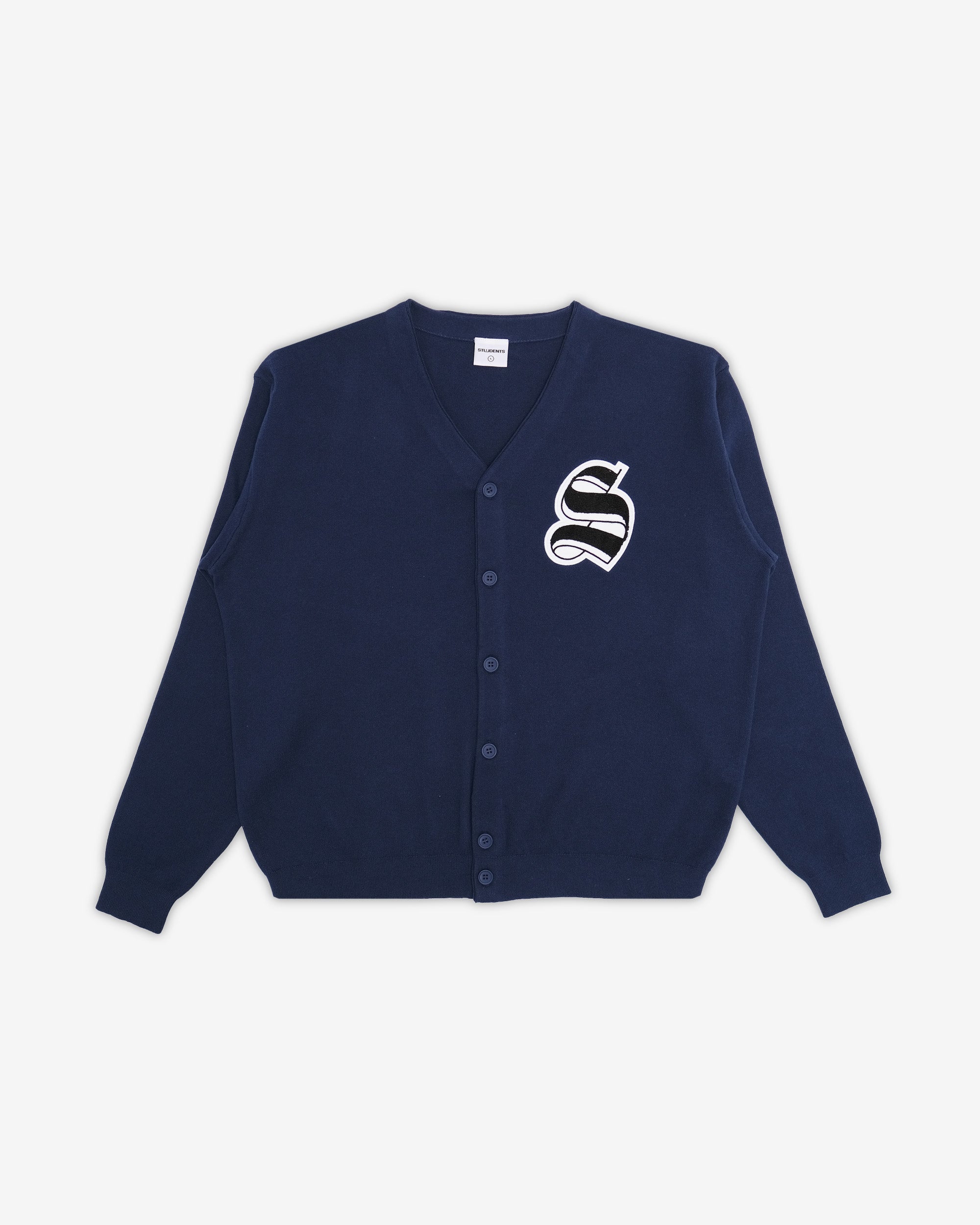 Navy blue cardigan with a white logo on a light gray background