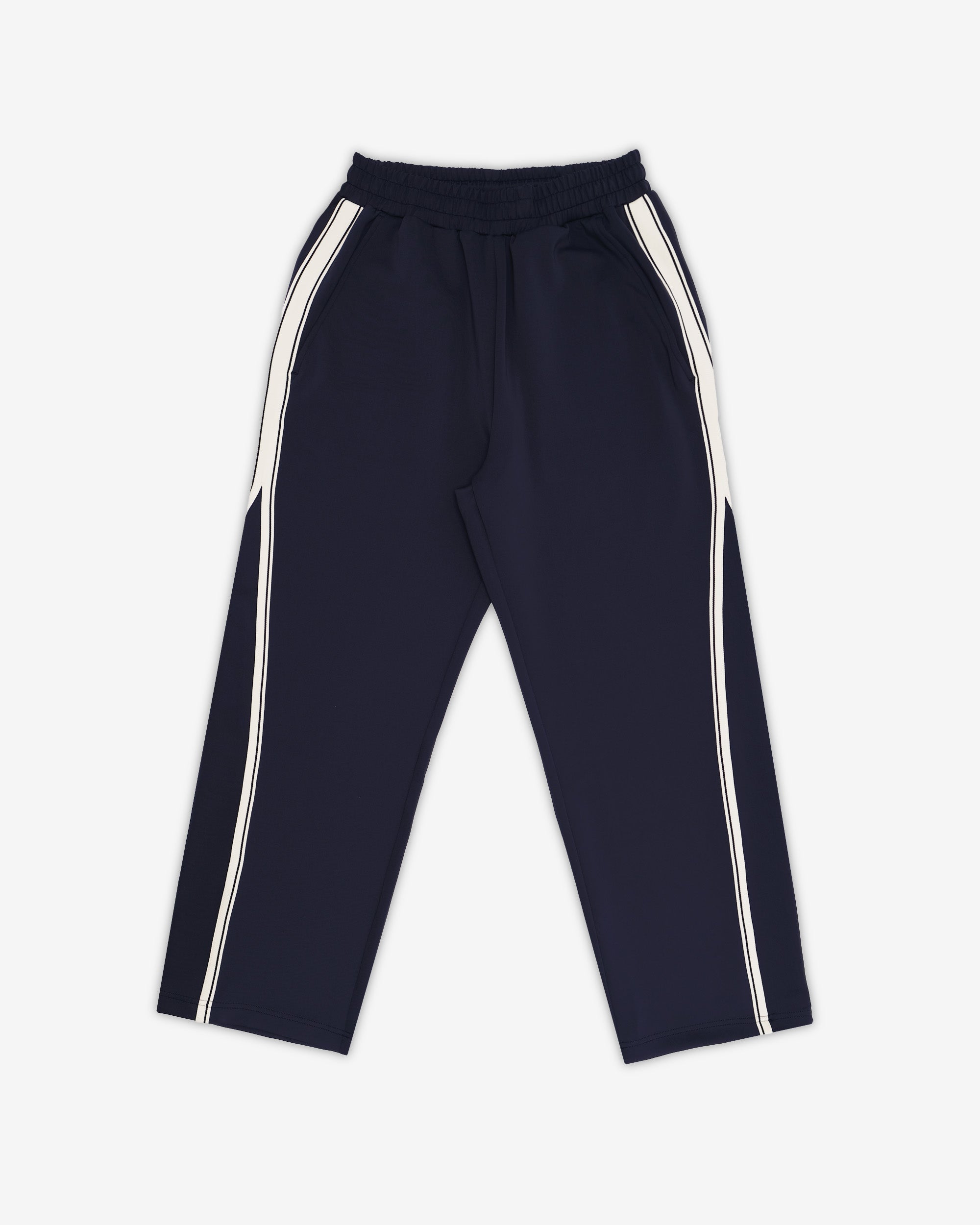 Navy track pants with white stripes on a white background