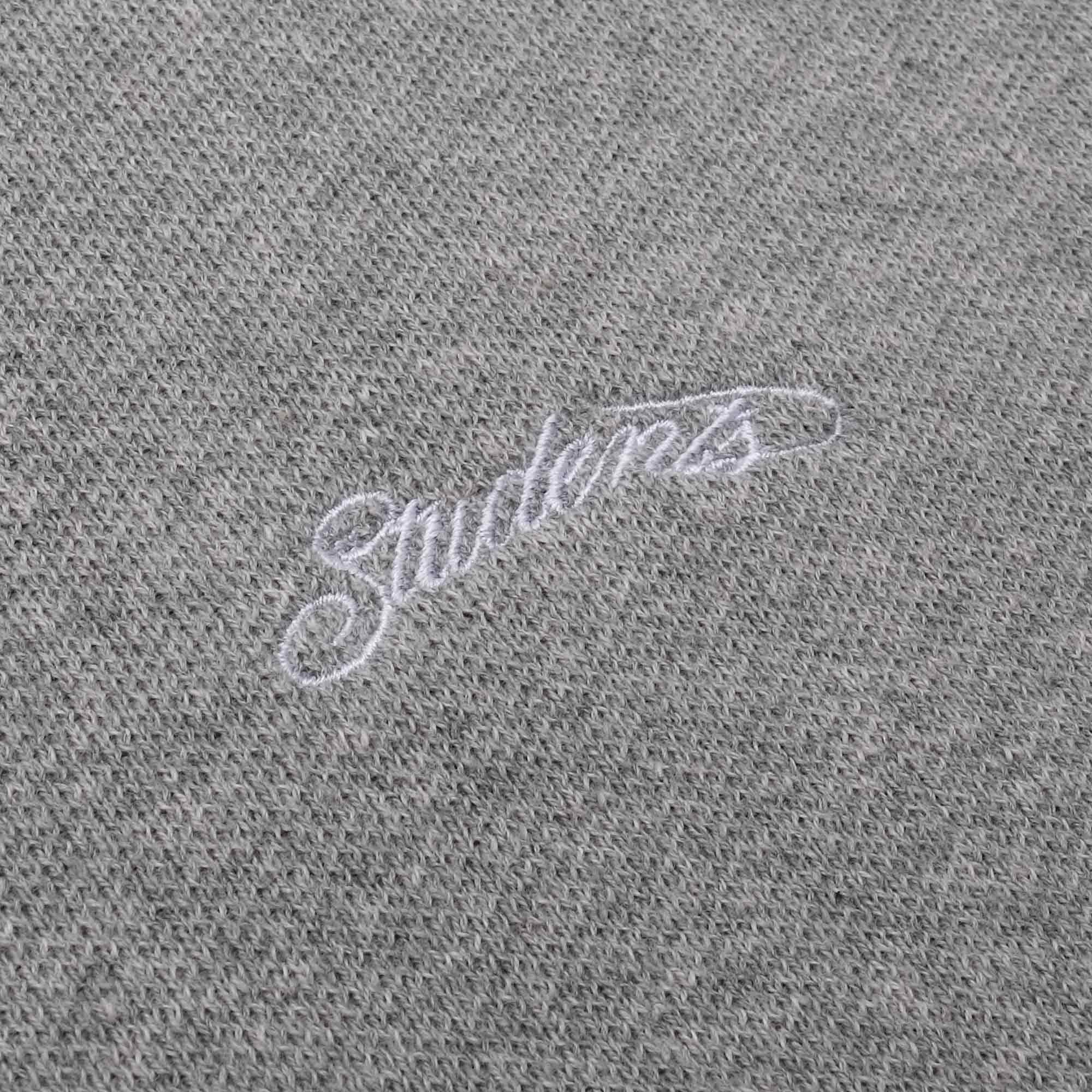 Gray fabric with 'Students' embroidered in white thread