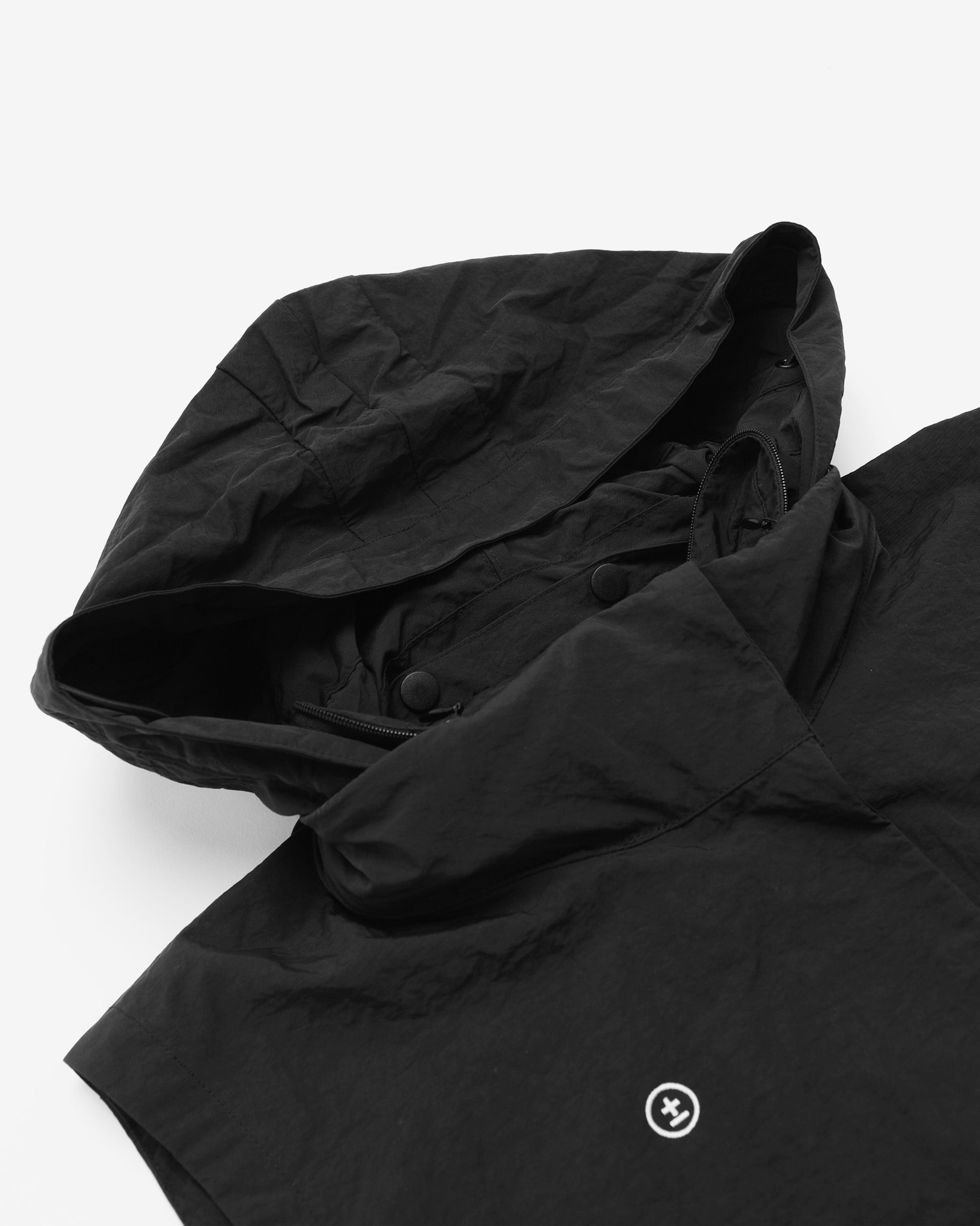 Black jacket with a brand logo on a white background