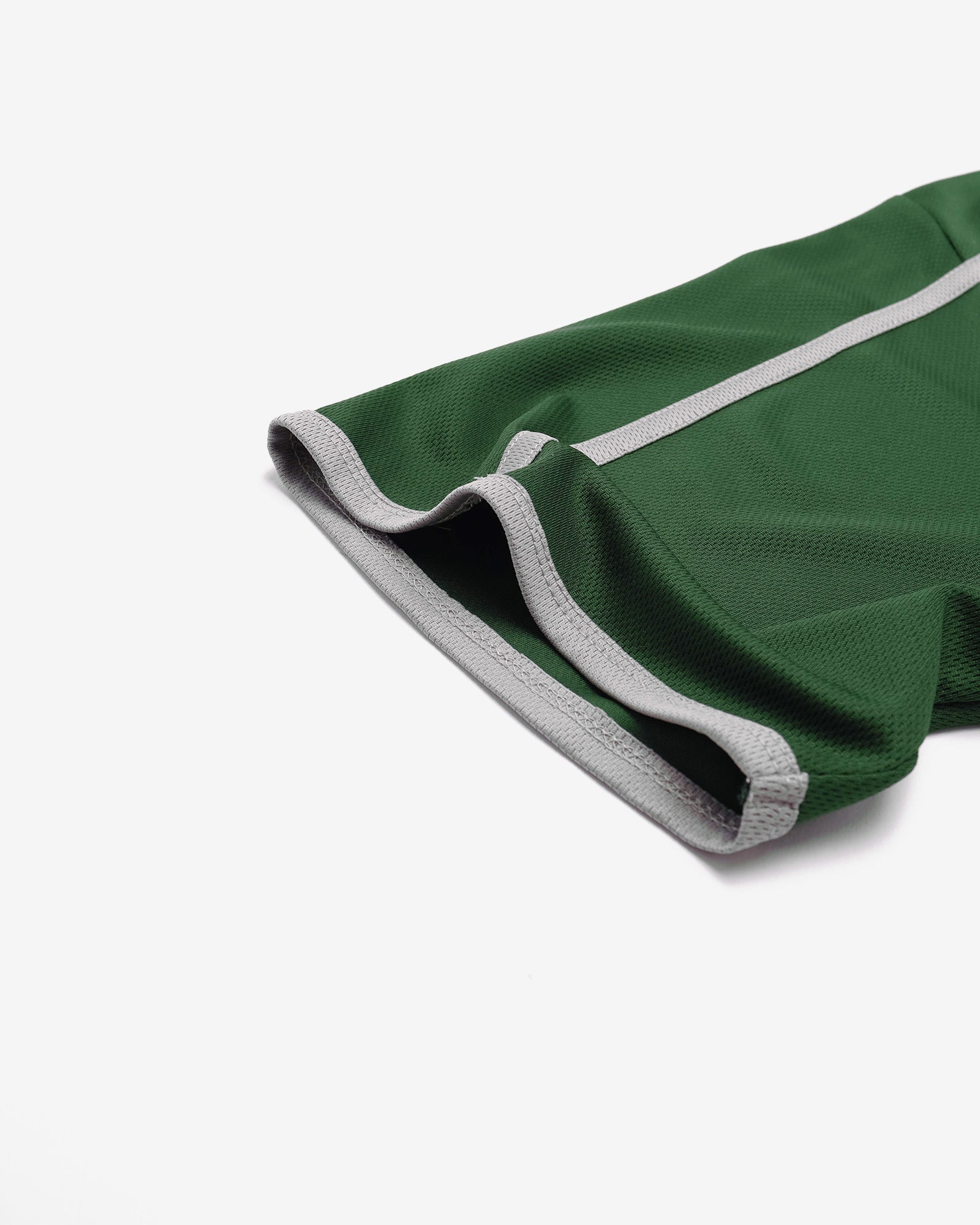 Green fabric with white trim on a white background