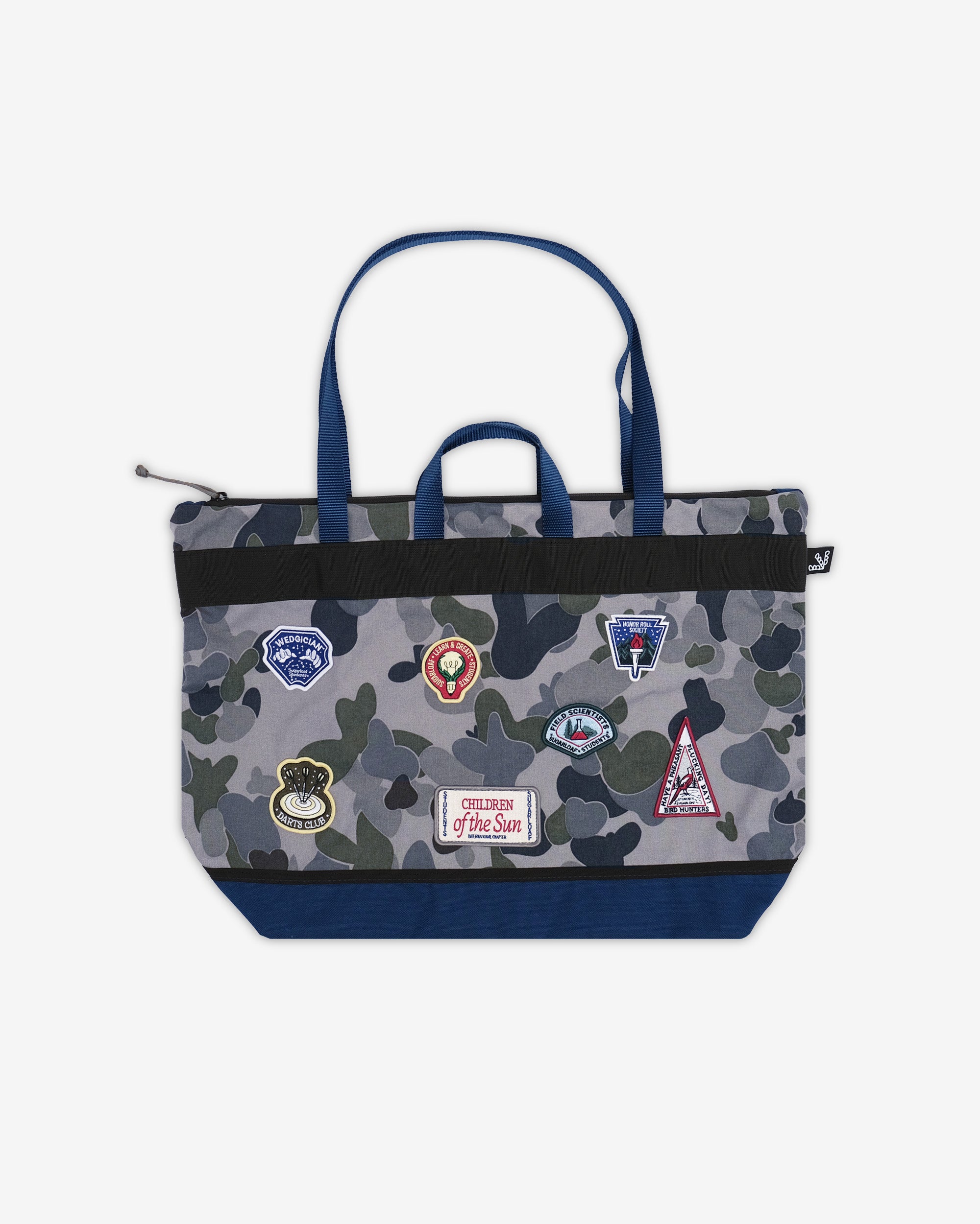Camouflage tote bag with patches on a white background