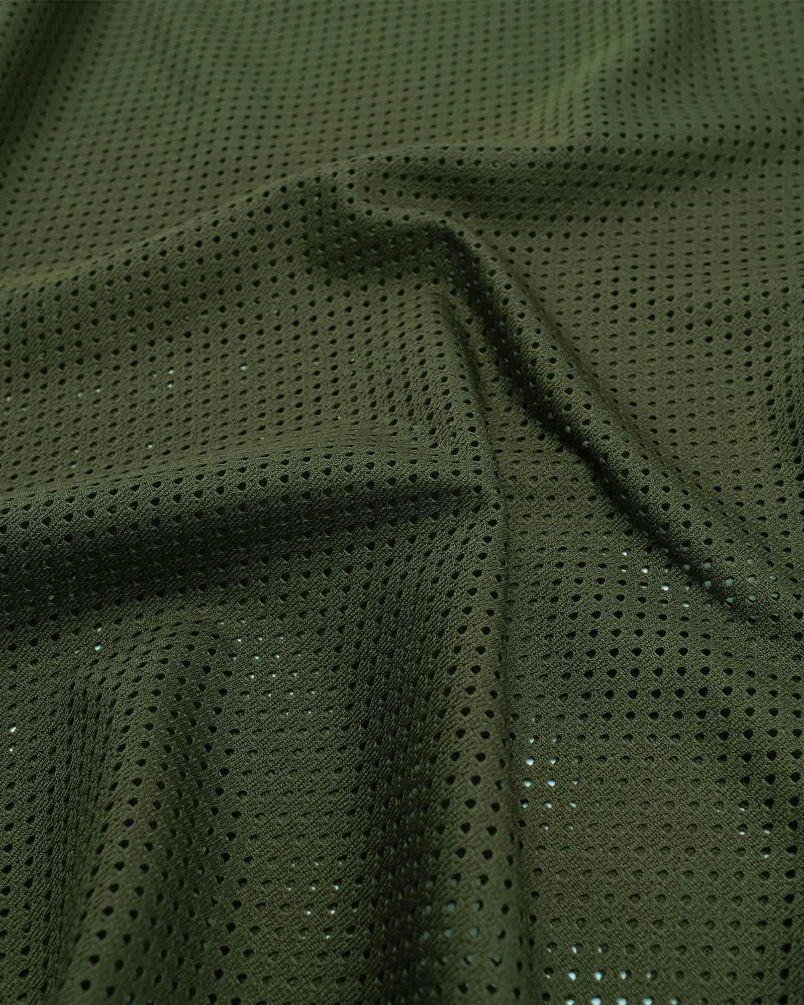 Close-up of green mesh fabric with sequins