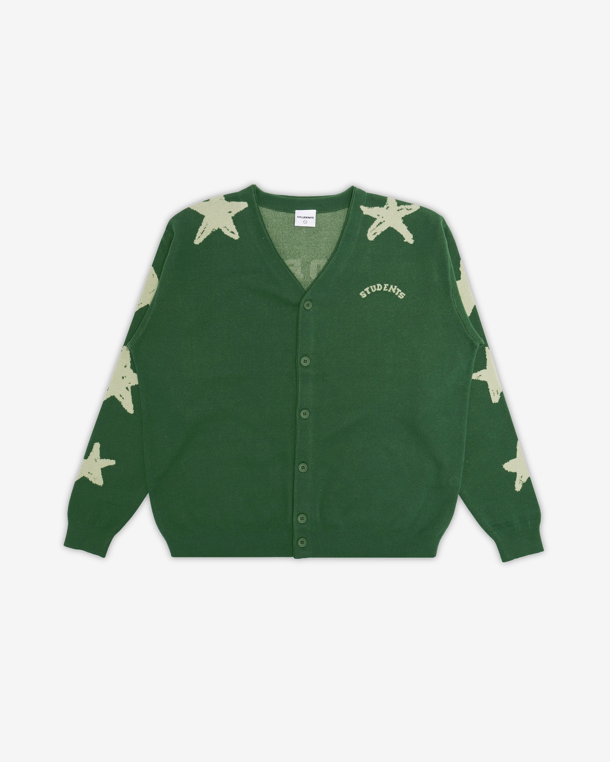 Green cardigan with star patterns on a white background